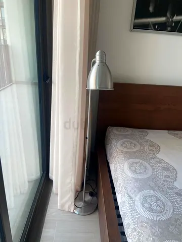 Silver metal floor reading lamp — adjustable modern design