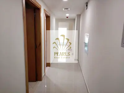 A two-bedroom apartment with a living room is available for annual rent in Emirates City, Ajman. It features two bathrooms but no parking, and the ren