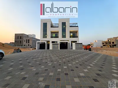 Brand-new super-deluxe villa for sale in Al Zahia, Ajman; features 5 master bedrooms; price includes fees.