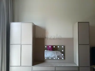 Modern bedroom wardrobe set with built-in dressing area and mirror