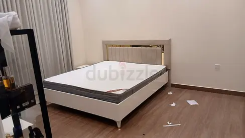 Nearly new queen bed frame with mattress included