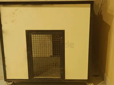 Wooden pet kennel/cage with metal door - sturdy, used