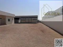 25kW Power Capacity Warehouse with Fenced Multi-Use Yard for Rent in Al Sajaa Industrial Area on the