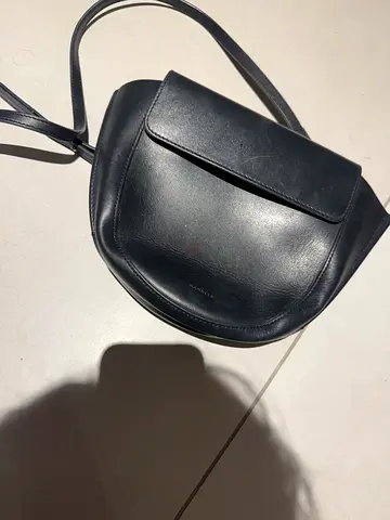 WANDLER  Black leather crossbody saddle bag