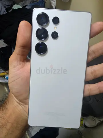 White Samsung smartphone with quad camera - good condition