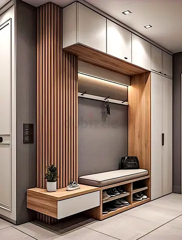 Modern built-in hallway storage bench with shoe racks and overhead cabinets