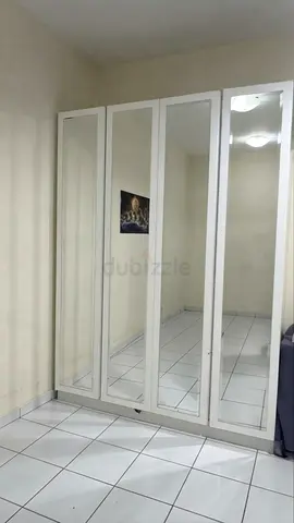 White 4-Door Wardrobe with Full-Length Mirrors - Good Condition