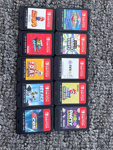 Lot of 11 Nintendo Switch game cartridges — mixed titles, working condition