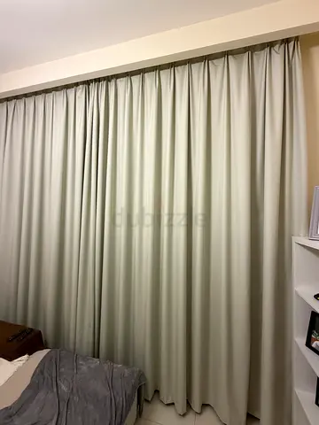Beige blackout curtains (approx 310cm height by 300cm width)