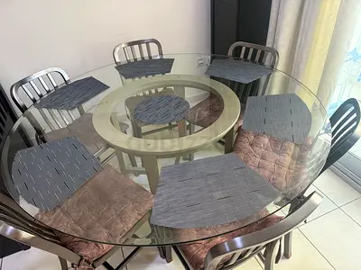 Crate and Barrel Dining Set - Round Dining Table with Glass Top and Six Metallic Chairs
