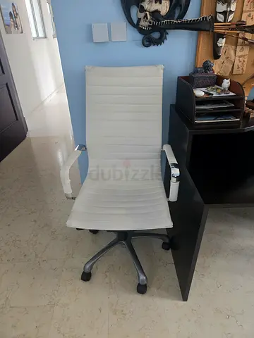 White ergonomic office chair with high back and armrests