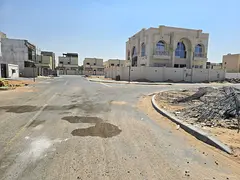 Residential/investment land for villa construction for sale in Al Helio 2, Ajman. The plot measures 