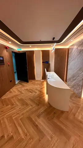 Modern curved reception desk and fitted office reception area
