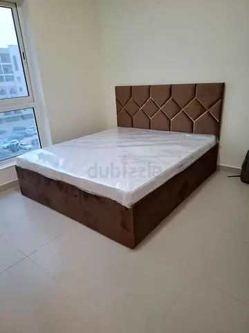 Queen brown upholstered bed with storage and mattress