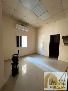 Studio for annual rent in Sharjah, featuring an excellent layout, a separate kitchen, and a neat, co