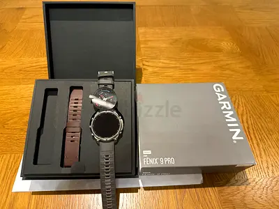 Garmin Fenix 9 Pro watch with extra straps — excellent condition