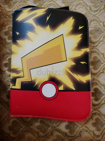 Pikachu-themed cars binder with cards in it