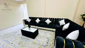 Furnished two-bedroom apartment for rent in Ajman, in a prime location near the Ship Roundabout and 
