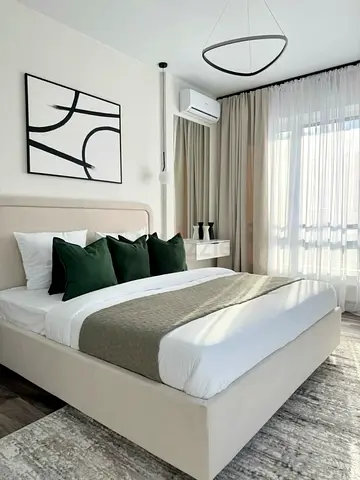 Beige upholstered double bed — excellent condition