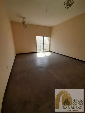 A two-bedroom apartment with a living room is available for annual rent in the Al Majarrah area of