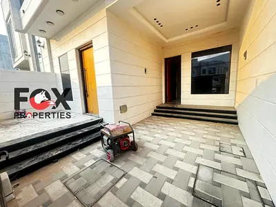 For rent in Al Heliw: a townhouse comprising a ground floor, first floor, and roof terrace. It features 4 master bedrooms, a majlis, two living area
