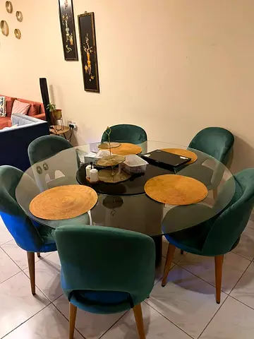 Round Glass Dining Table with 6 Green Velvet Chairs
