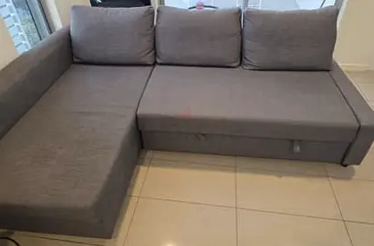 Grey L-shaped Fabric Sofa Bed with Storage - Good Condition