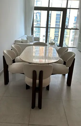 Modern marble-top dining table with 6 upholstered chairs