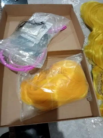 Set of yellow and orange cosplay wigs and hairpieces - new, unusedFor Halloween both 50 dhs