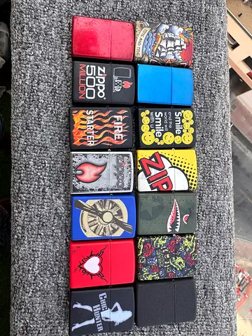 Collection of 32 Zippo-style Lighters — Assorted Designs, Used