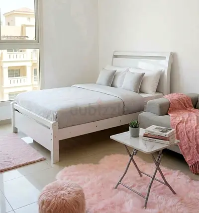 White wooden double bed frame with simple headboard - good condition