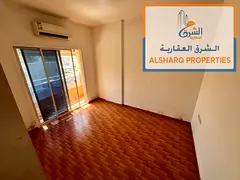One bedroom and living room, 2 bathrooms, balcony, split A/C, prime location, easy access to Dubai a
