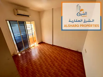 One bedroom and living room, 2 bathrooms, balcony, split A/C, prime location, easy access to Dubai