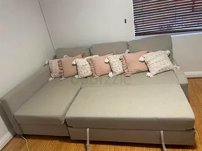 Light grey L-shaped sectional sofa bed with storage/convertible seating