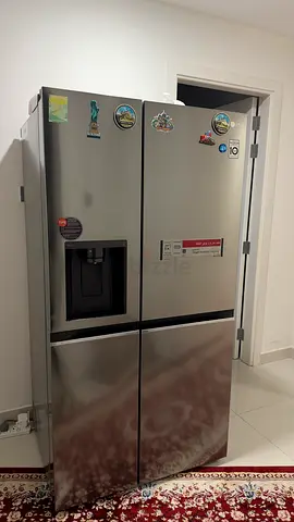 LG Four-Door Stainless Steel Refrigerator with Water Dispenser - Excellent Condition