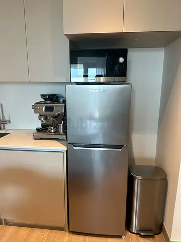 Silver two-door refrigerator in good condition