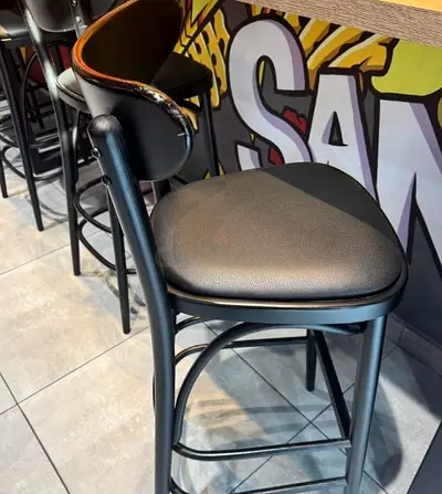 Set of black bar stools with padded seats