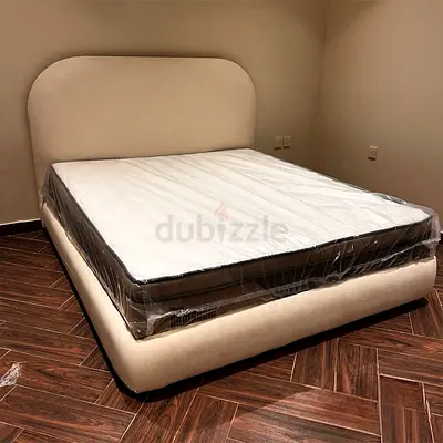 Queen upholstered bed frame (like new)
