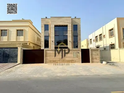 Distinctive Villa for Sale in Al Muwaihat 2 – Ajman | Two Floors + Roof | 5 Bedrooms | 4,500 sq. ft.** Prime location near all amenities; spacious des