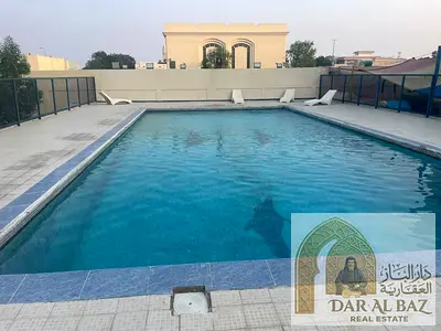 4-bedroom villa with 2 majlises available for annual rent in Sharqan, second row from the Corniche; features master bedrooms, 5 bathrooms, a maid's ro