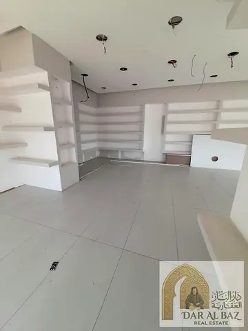 Shop for annual rent in the Al Majarrah area of ​​Sharjah; it boasts a prime location directly on t