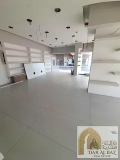 Shop for annual rent in the Al Majarrah area of ​​Sharjah; it boasts a prime location directly o