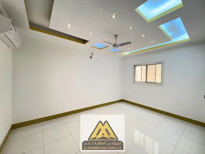For Annual Rent in Al Jurf 2 – Ajman, a spacious two-bedroom apartment with a large living room, kitchen, and laundry room. The apartment features spl