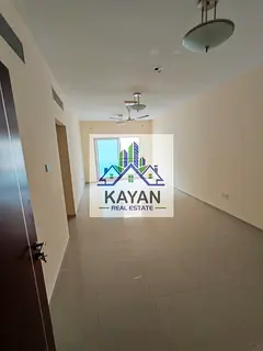 For annual rent: a two-bedroom apartment with a living room in a prime location, opposite Umm Al Quw