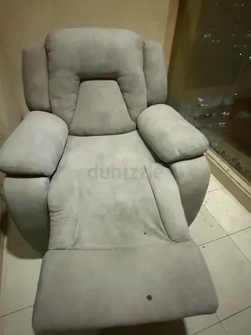 Light grey reclining armchair in good used condition