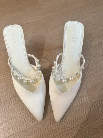 White pearl-embellished pointed mules by Meshki, size 39