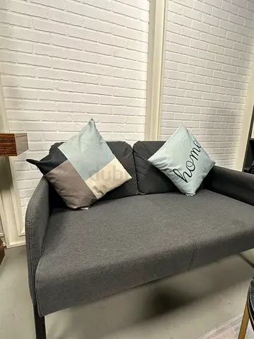 Grey 2-seater sofa in good condition