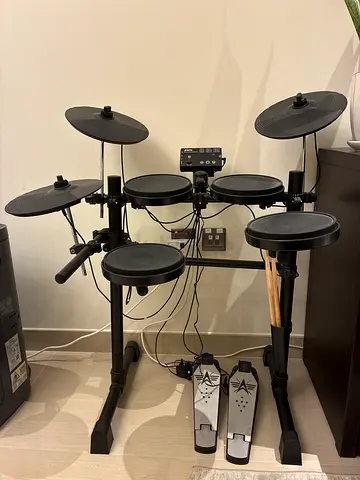 Electronic Drum Kit with Cymbals and Dual Pedals.