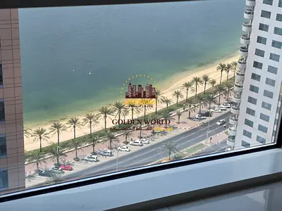 2BR apartment in Al Khan, Sharjah, AED 65K/year. Free AC, parking, pool, gym, clean finish, 24/7 security, and free contract attestation.