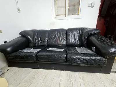 Used black leather 3-seater sofa - worn but functional